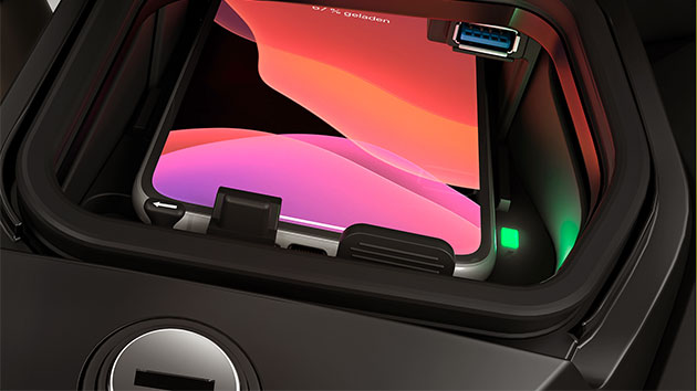 We see the storage compartment for the smartphone with wireless induction charging.